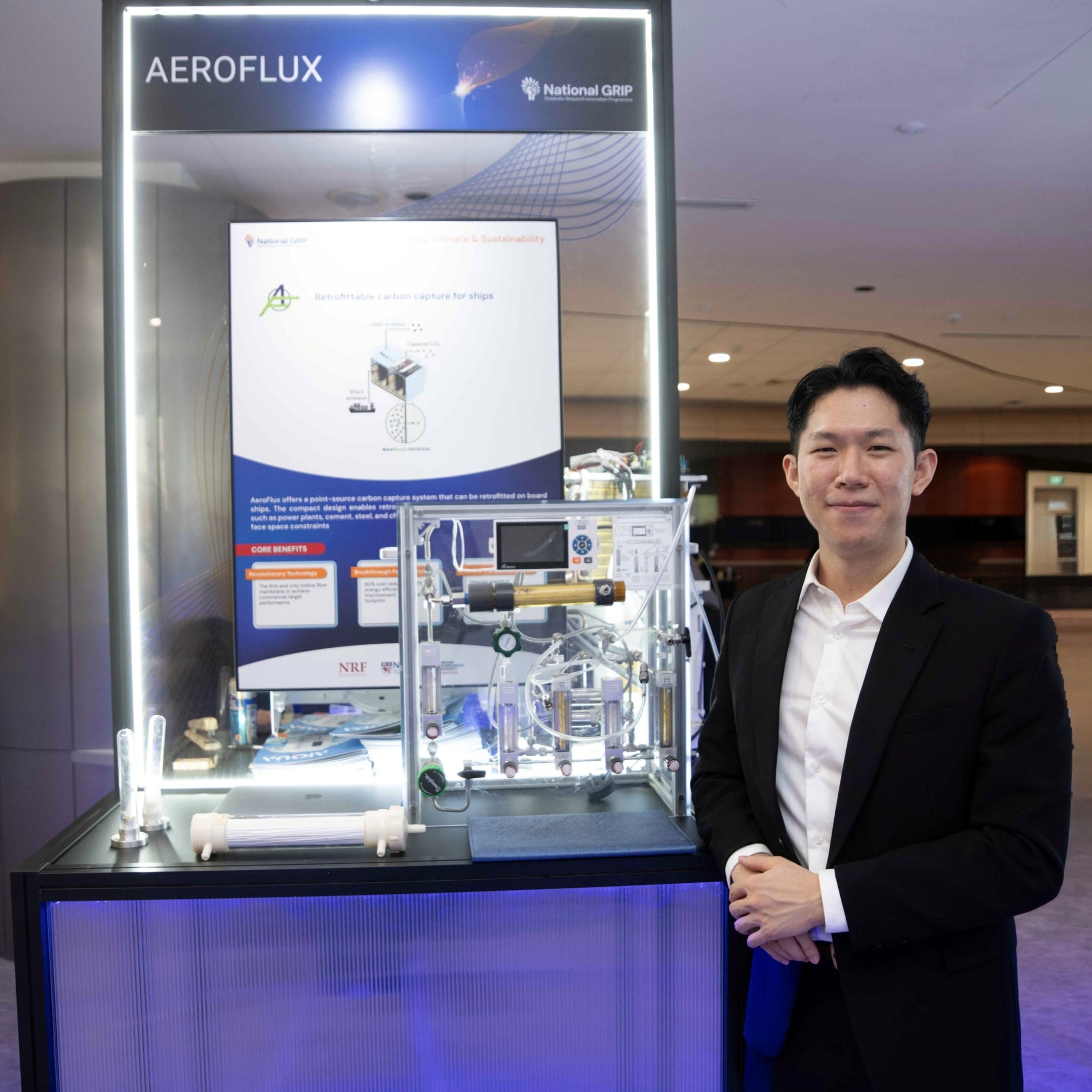 Man standing infront of Machine